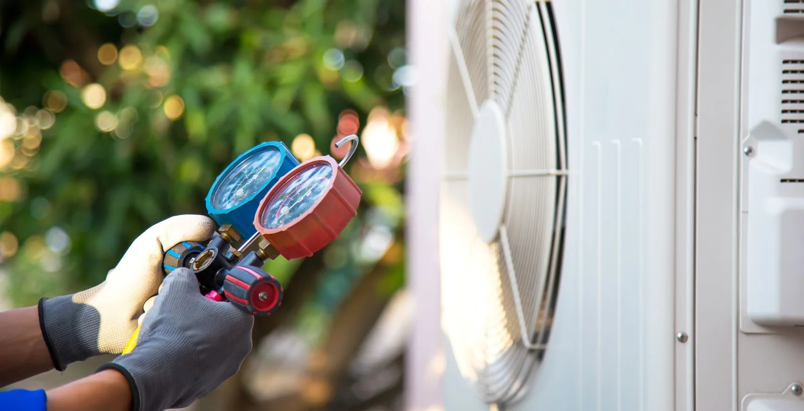 Technician testing residential HVAC electrical components with a multimeter